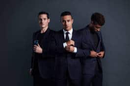 Three footballers in suits 