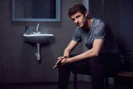 Thomas Mueller sitting in locker room in casual 