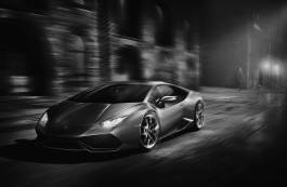 Monochrome of Lamborghini speeding at night. 