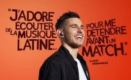 Smiling Lukas Hernandez with headphones on 