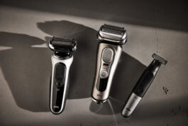 Three Braun shavers casting shadow on surface 