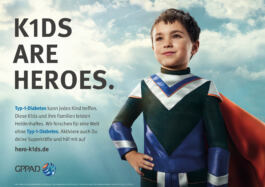 A child in superhero costume is smiling confidently beside text promoting awareness of Type-1 Diabetes. Background shows a cloudy sky. 